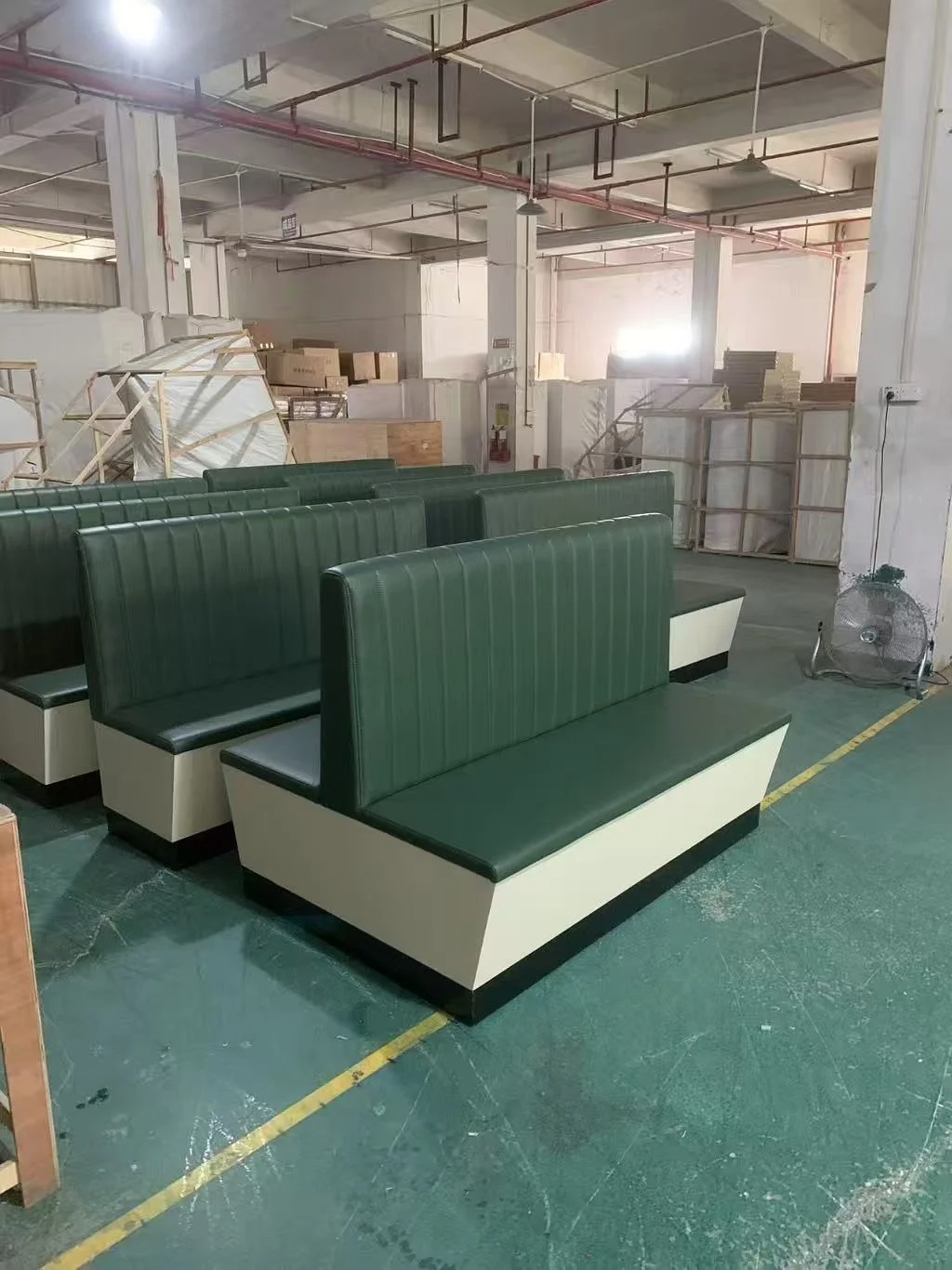 Green channel-back double-sided restaurant booth sections