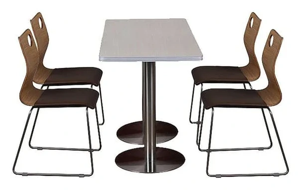 Rectangular twin-pedestal dining table surrounded by four dark open-back chairs
