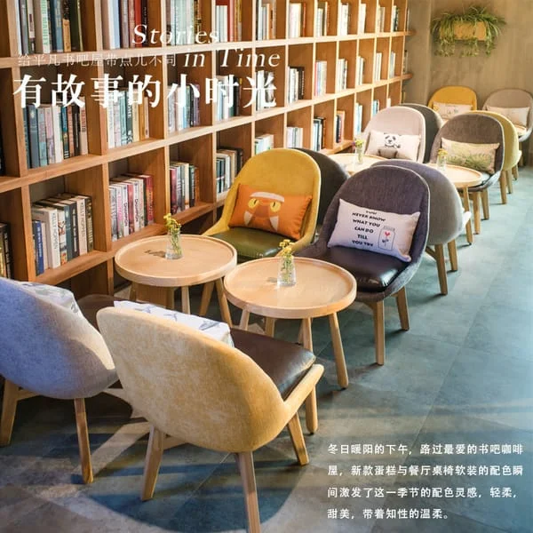 Round Café Table with Upholstered Lounge Chairs