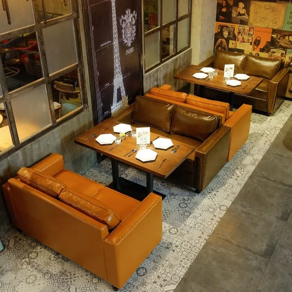 Tan Café Sofas with Rectangular Pedestal Tables